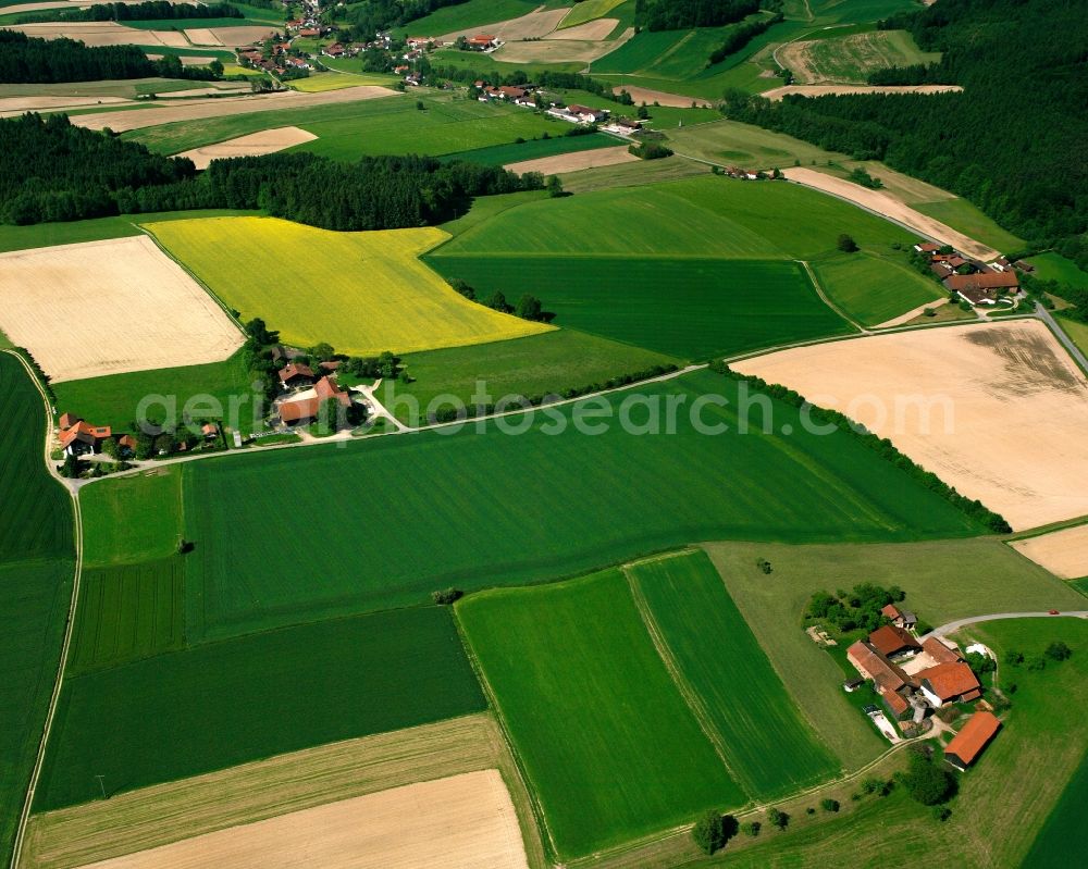 Kager from the bird's eye view: Agricultural land and field boundaries surround the settlement area of the village in Kager in the state Bavaria, Germany