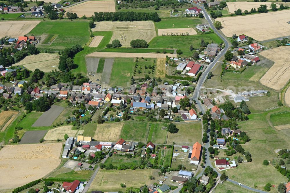 Aerial image Kakau - Agricultural land and field boundaries surround the settlement area of the village in Kakau in the state Saxony-Anhalt, Germany