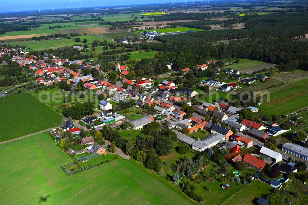 Kakerbeck from above - Agricultural land and field boundaries surround the settlement area of the village in Kakerbeck in the state Saxony-Anhalt, Germany