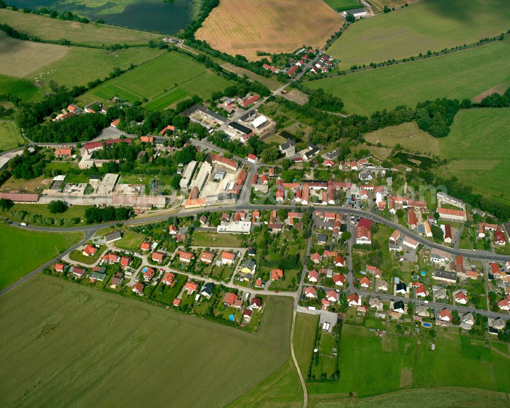 Kalkreuth from the bird's eye view: Agricultural land and field boundaries surround the settlement area of the village in Kalkreuth in the state Saxony, Germany