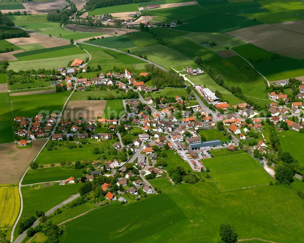 Kanzach from the bird's eye view: Agricultural land and field boundaries surround the settlement area of the village in Kanzach in the state Baden-Wuerttemberg, Germany