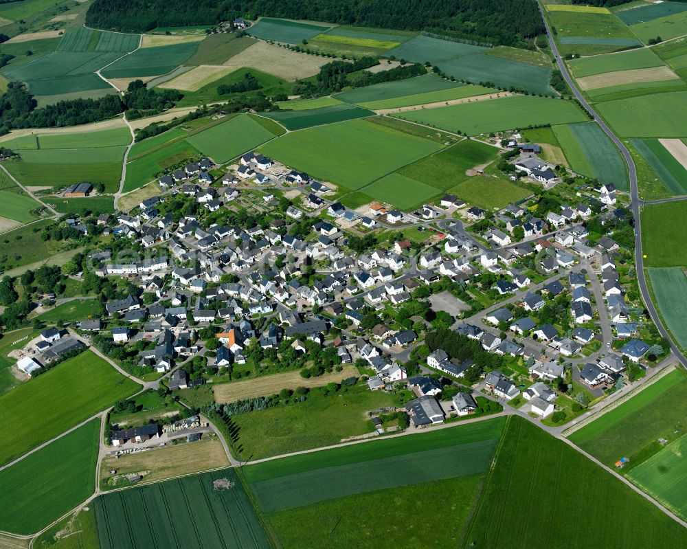 Aerial photograph Karbach - Agricultural land and field boundaries surround the settlement area of the village in Karbach in the state Rhineland-Palatinate, Germany