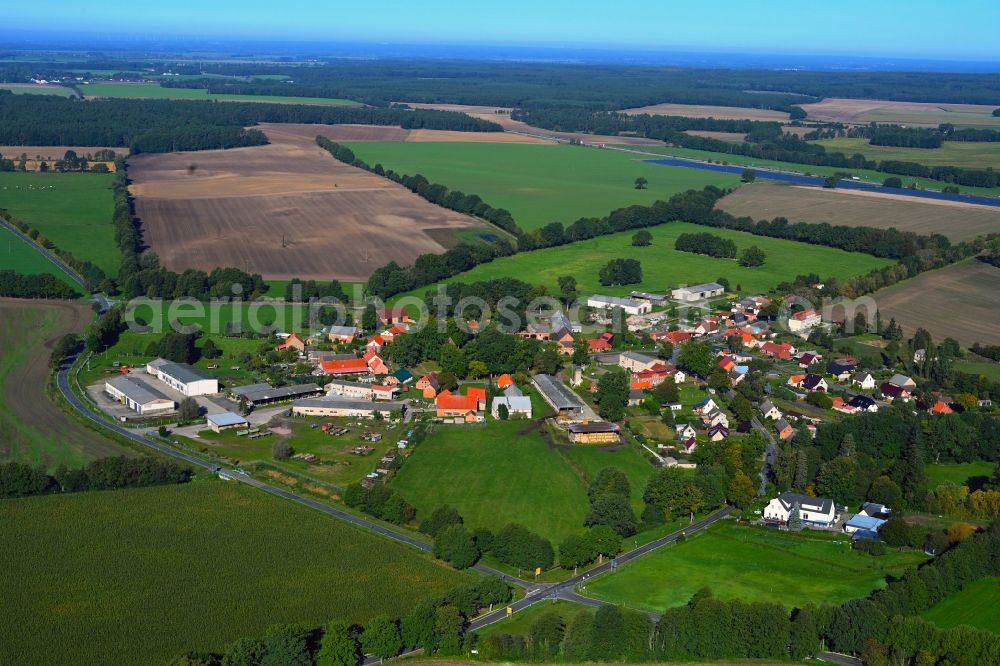 Karrenzin from the bird's eye view: Agricultural land and field boundaries surround the settlement area of the village in Karrenzin in the state Mecklenburg - Western Pomerania, Germany