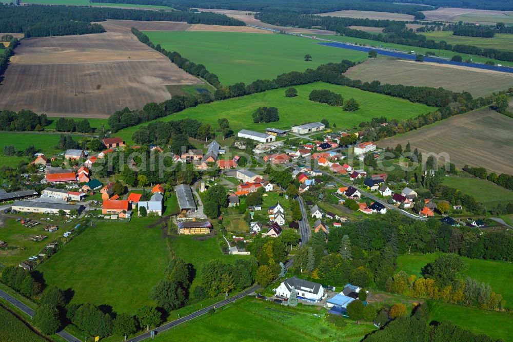 Aerial image Karrenzin - Agricultural land and field boundaries surround the settlement area of the village in Karrenzin in the state Mecklenburg - Western Pomerania, Germany