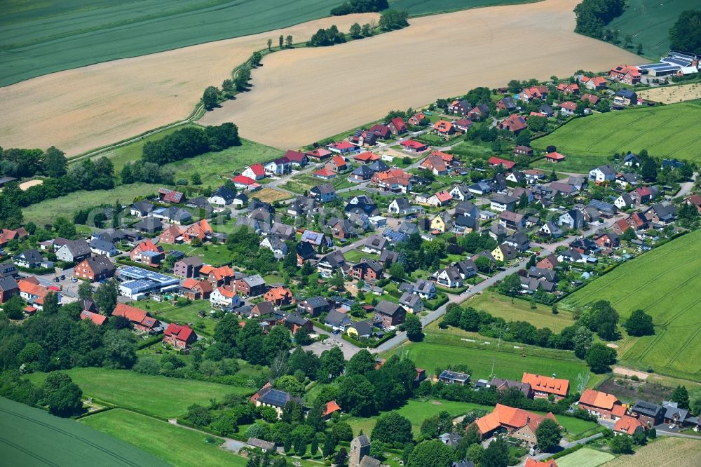 Kathrinhagen from above - Agricultural land and field boundaries surround the settlement area of the village in Kathrinhagen in the state Lower Saxony, Germany