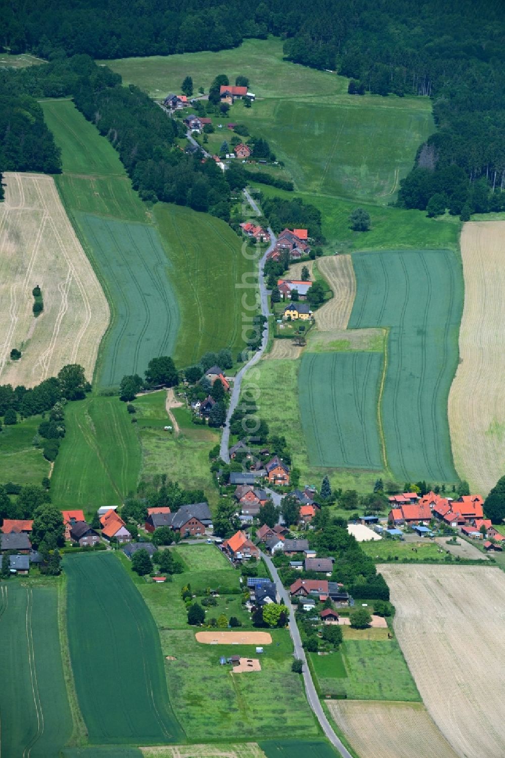 Kathrinhagen from above - Agricultural land and field boundaries surround the settlement area of the village in Kathrinhagen in the state Lower Saxony, Germany