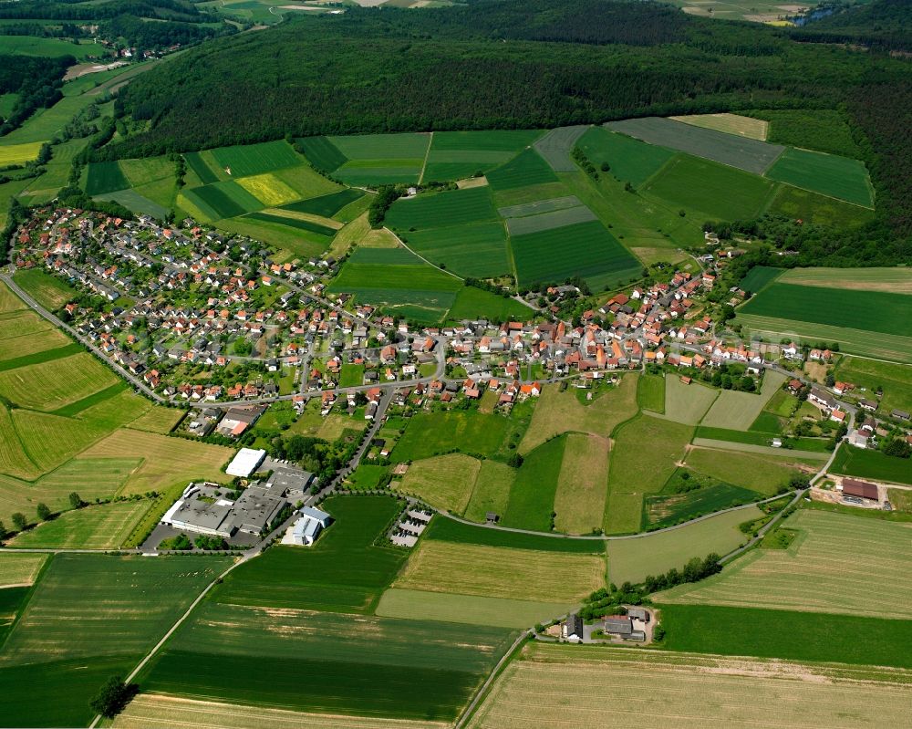 Aerial image Kathus - Agricultural land and field boundaries surround the settlement area of the village in Kathus in the state Hesse, Germany