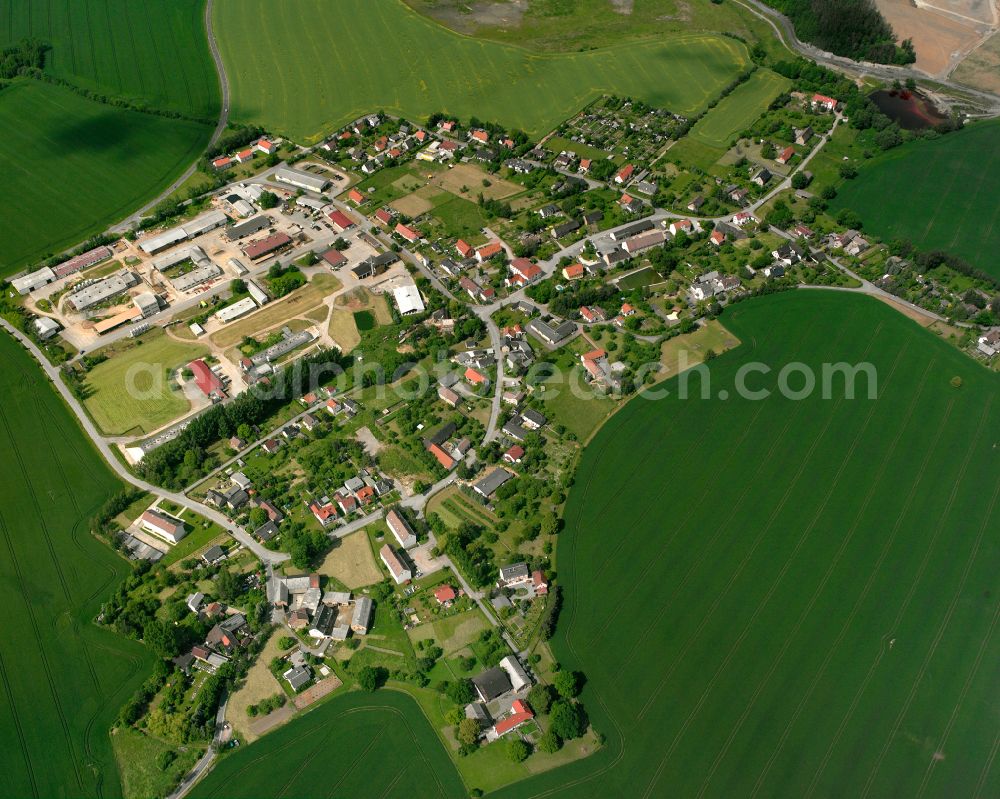 Kauern from above - Agricultural land and field boundaries surround the settlement area of the village in Kauern in the state Thuringia, Germany