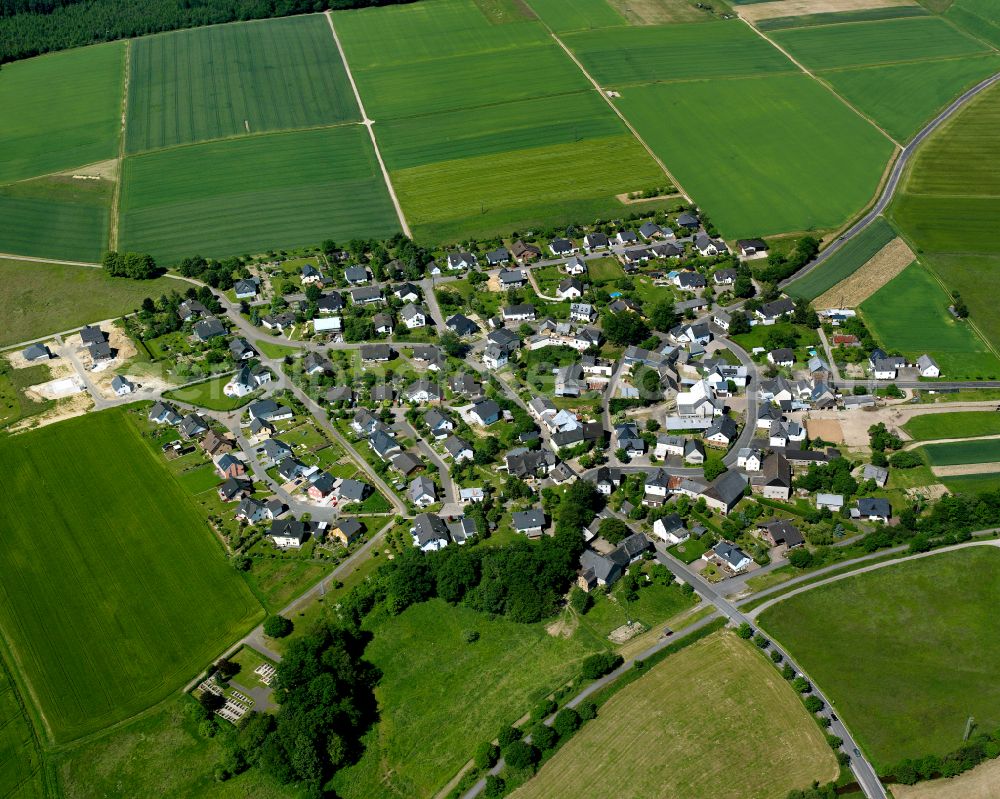 Keidelheim from above - Agricultural land and field boundaries surround the settlement area of the village in Keidelheim in the state Rhineland-Palatinate, Germany