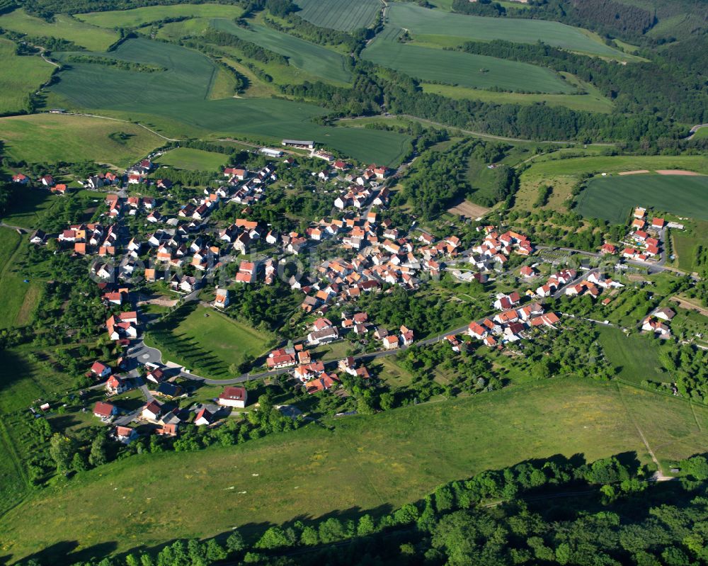 Kella from the bird's eye view: Agricultural land and field boundaries surround the settlement area of the village in Kella in the state Thuringia, Germany