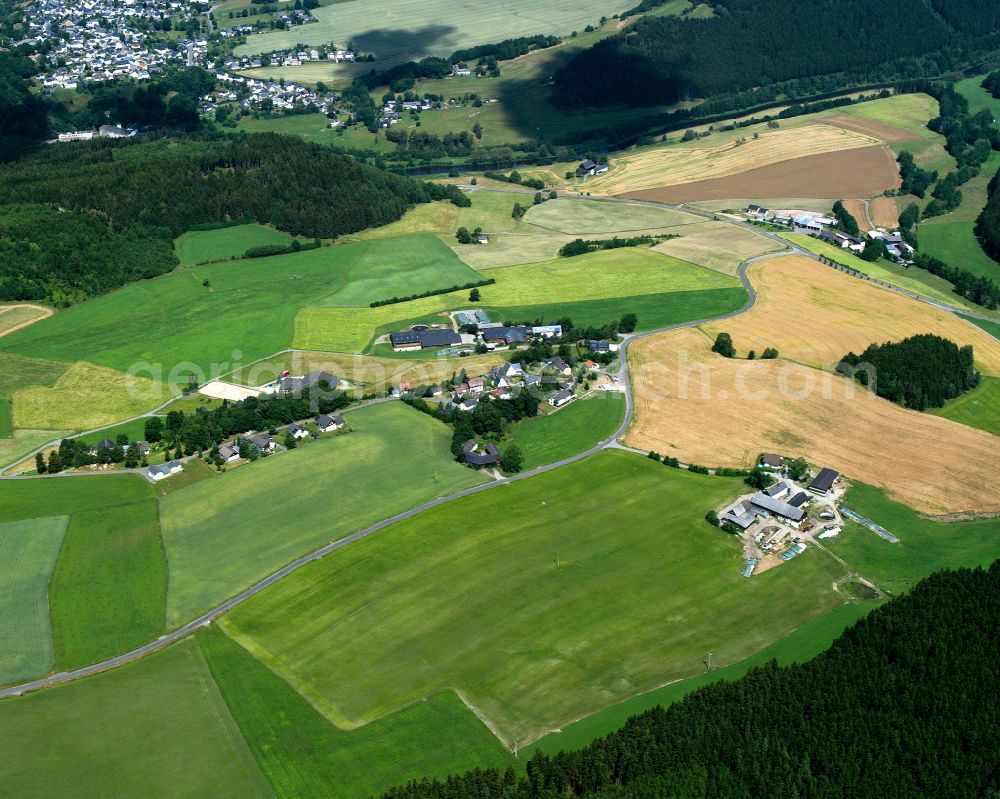 Kemlas from above - Agricultural land and field boundaries surround the settlement area of the village in Kemlas in the state Bavaria, Germany