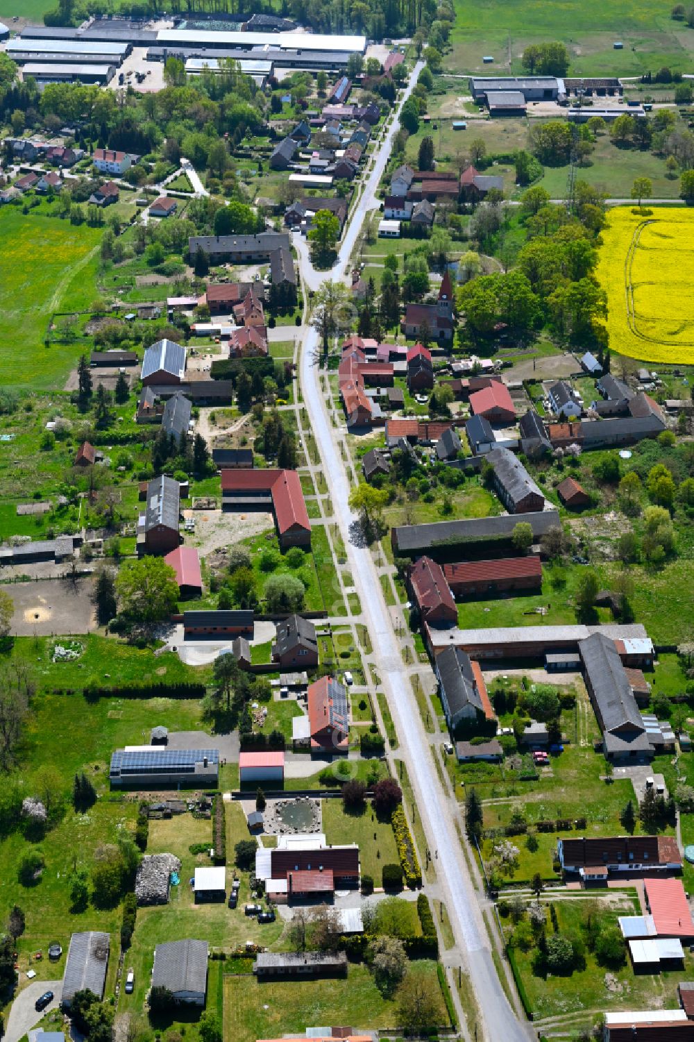 Kerkau from above - Agricultural land and field boundaries surround the settlement area of the village in Kerkau in the state Saxony-Anhalt, Germany