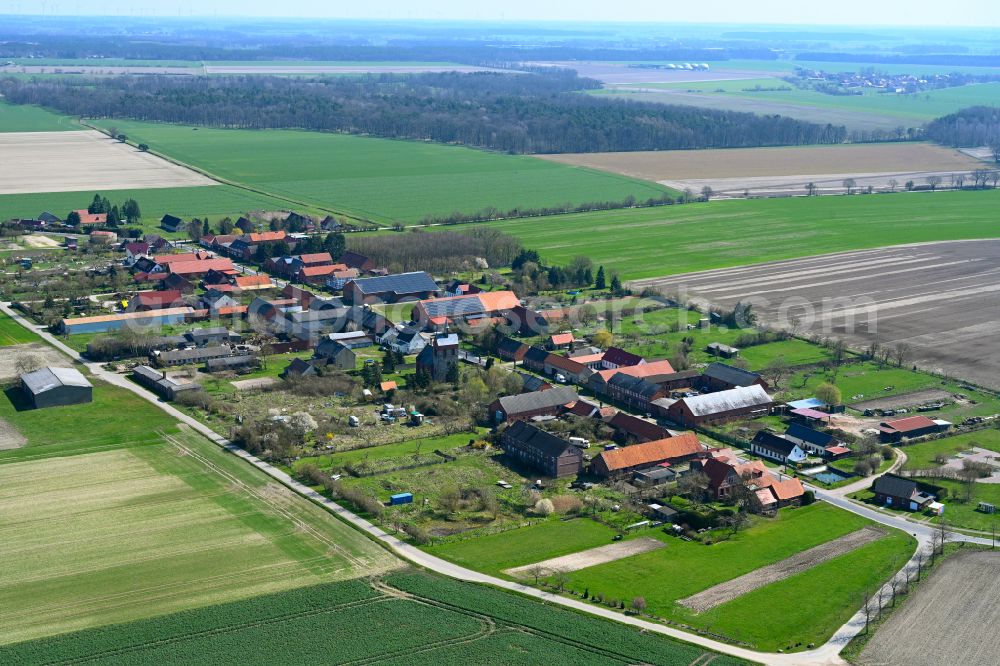 Kerkuhn from the bird's eye view: Agricultural land and field boundaries surround the settlement area of the village in Kerkuhn in the state Saxony-Anhalt, Germany