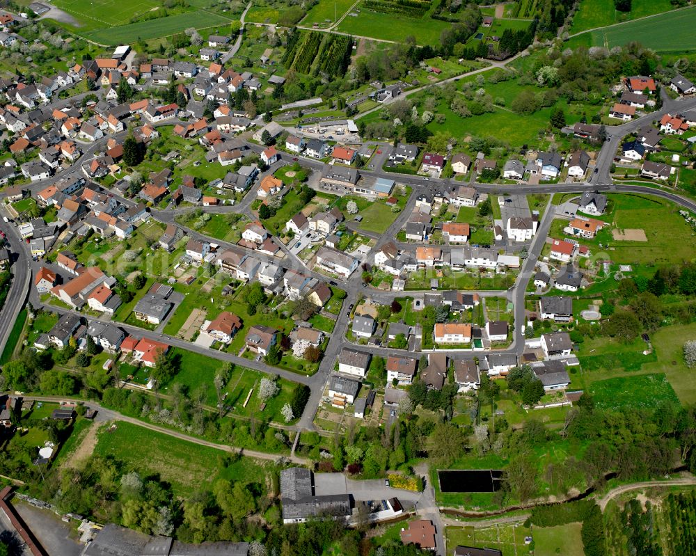 Aerial image Kesselbach - Agricultural land and field boundaries surround the settlement area of the village in Kesselbach in the state Hesse, Germany