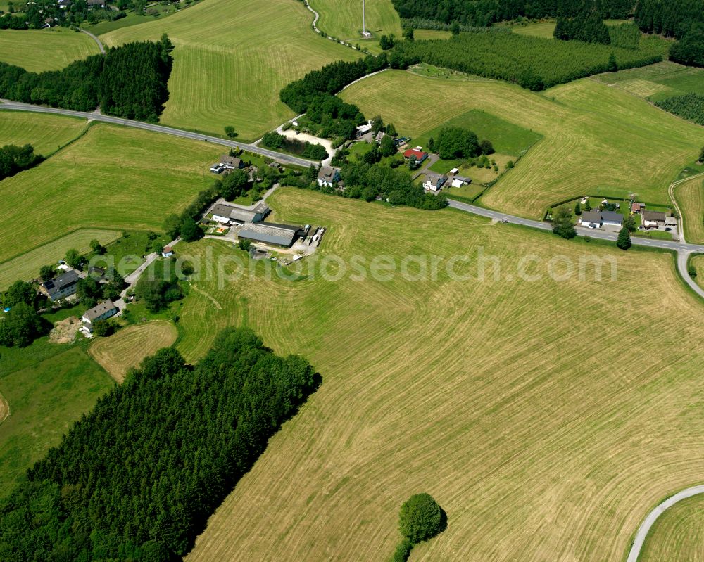 Kierspe from above - Agricultural land and field boundaries surround the settlement area of the village in Kierspe in the state North Rhine-Westphalia, Germany