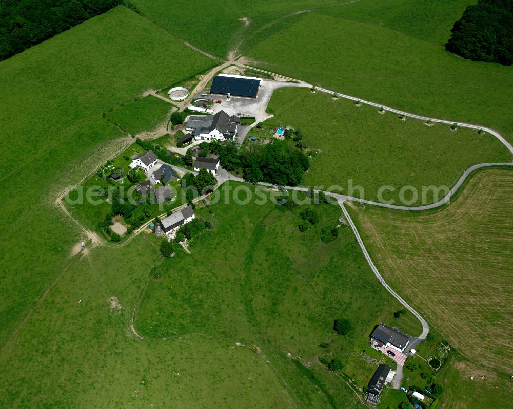 Aerial image Kierspe - Agricultural land and field boundaries surround the settlement area of the village in Kierspe in the state North Rhine-Westphalia, Germany