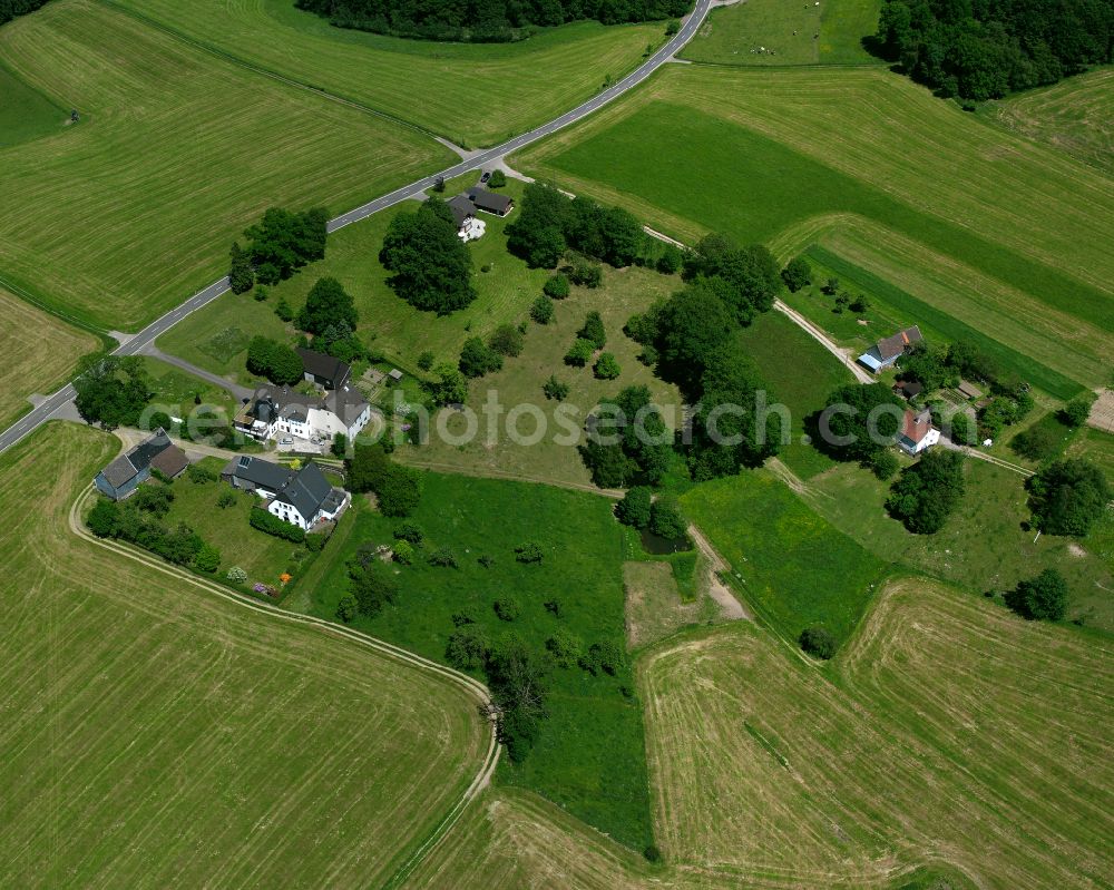 Aerial photograph Kierspe - Agricultural land and field boundaries surround the settlement area of the village in Kierspe in the state North Rhine-Westphalia, Germany