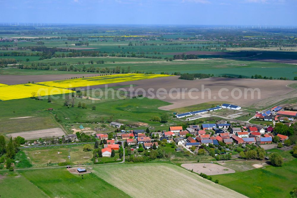 Aerial image Kietz - Agricultural land and field boundaries surround the settlement area of the village in Kietz in the state Brandenburg, Germany