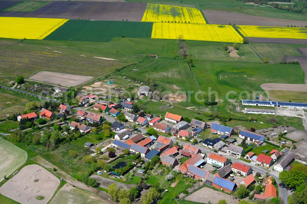 Kietz from above - Agricultural land and field boundaries surround the settlement area of the village in Kietz in the state Brandenburg, Germany