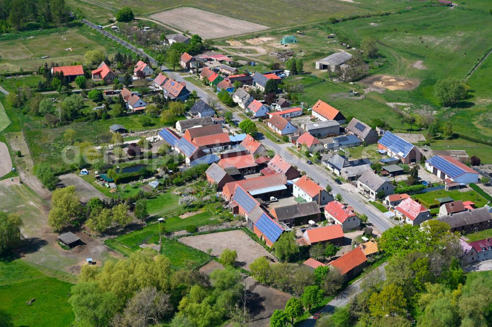 Aerial image Kietz - Agricultural land and field boundaries surround the settlement area of the village in Kietz in the state Brandenburg, Germany