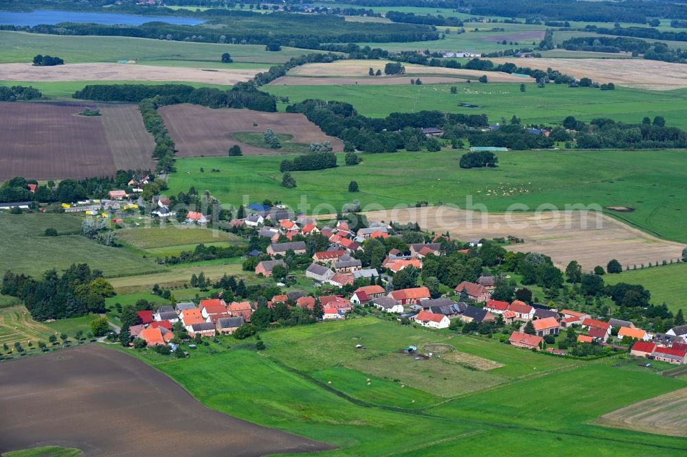 Kieve from above - Agricultural land and field boundaries surround the settlement area of the village in Kieve in the state Mecklenburg - Western Pomerania, Germany