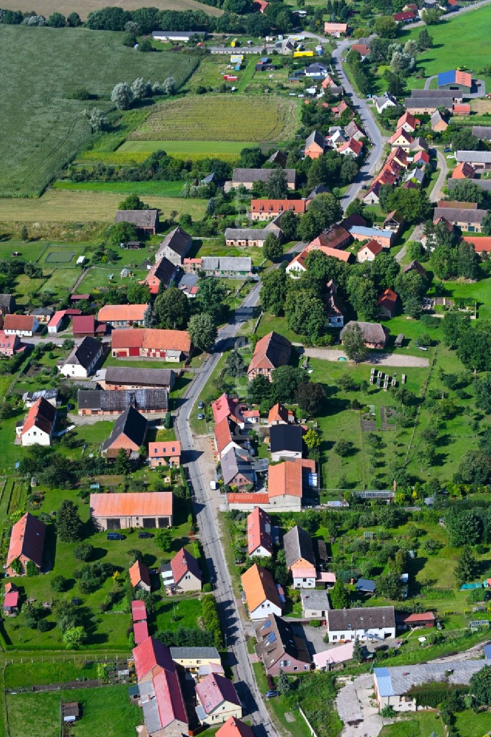 Kieve from above - Agricultural land and field boundaries surround the settlement area of the village in Kieve in the state Mecklenburg - Western Pomerania, Germany