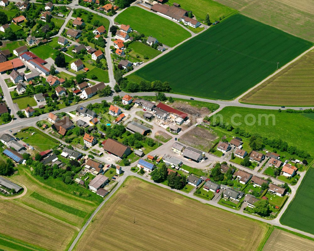 Kirchberg from above - Agricultural land and field boundaries surround the settlement area of the village in Kirchberg in the state Baden-Wuerttemberg, Germany