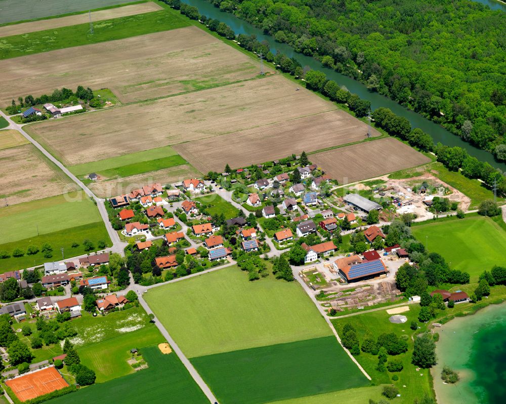 Kirchberg an der Iller from the bird's eye view: Agricultural land and field boundaries surround the settlement area of the village in Kirchberg an der Iller in the state Baden-Wuerttemberg, Germany