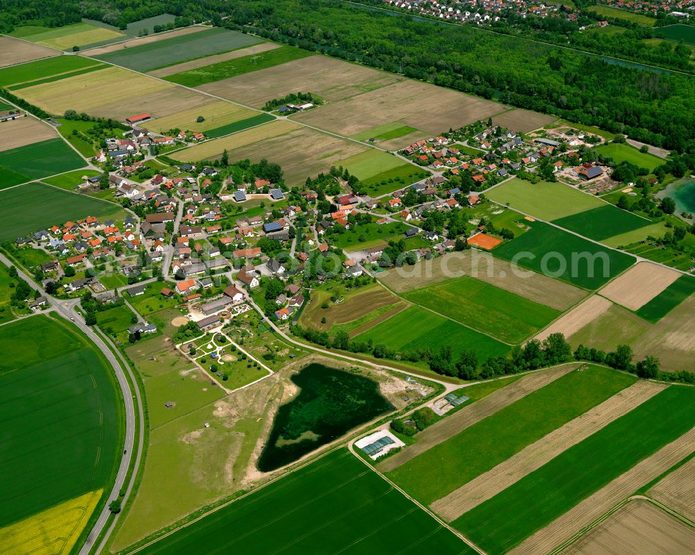 Aerial photograph Kirchberg an der Iller - Agricultural land and field boundaries surround the settlement area of the village in Kirchberg an der Iller in the state Baden-Wuerttemberg, Germany