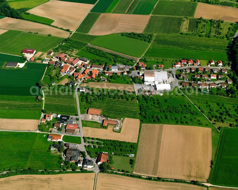 Kirschenhardthof from above - Agricultural land and field boundaries surround the settlement area of the village in Kirschenhardthof in the state Baden-Wuerttemberg, Germany