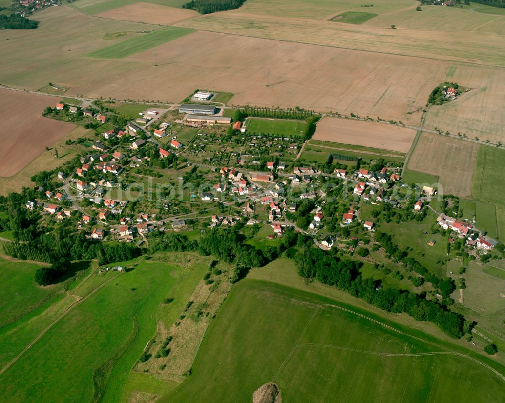 Kleinfalke from above - Agricultural land and field boundaries surround the settlement area of the village in Kleinfalke in the state Thuringia, Germany