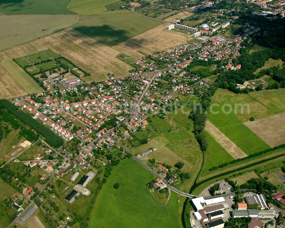 Kleinraschütz from above - Agricultural land and field boundaries surround the settlement area of the village in Kleinraschütz in the state Saxony, Germany