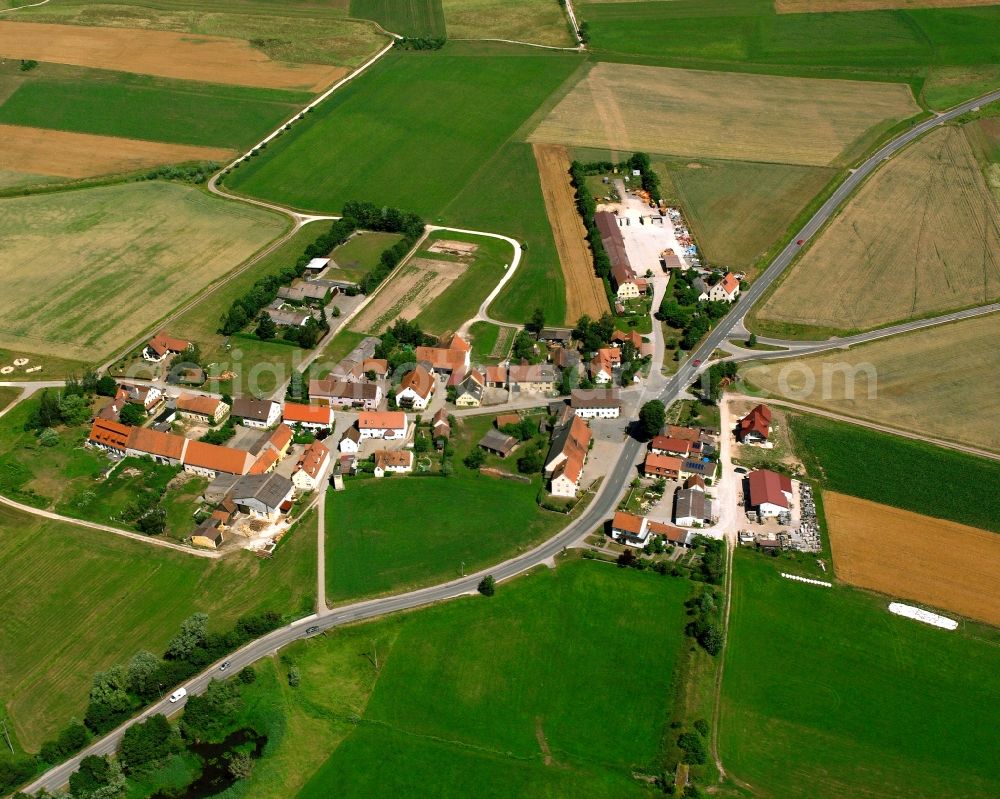 Kleinried from the bird's eye view: Agricultural land and field boundaries surround the settlement area of the village in Kleinried in the state Bavaria, Germany