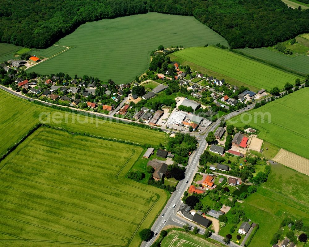 Kleinschretstaken from the bird's eye view: Agricultural land and field boundaries surround the settlement area of the village in Kleinschretstaken in the state Schleswig-Holstein, Germany