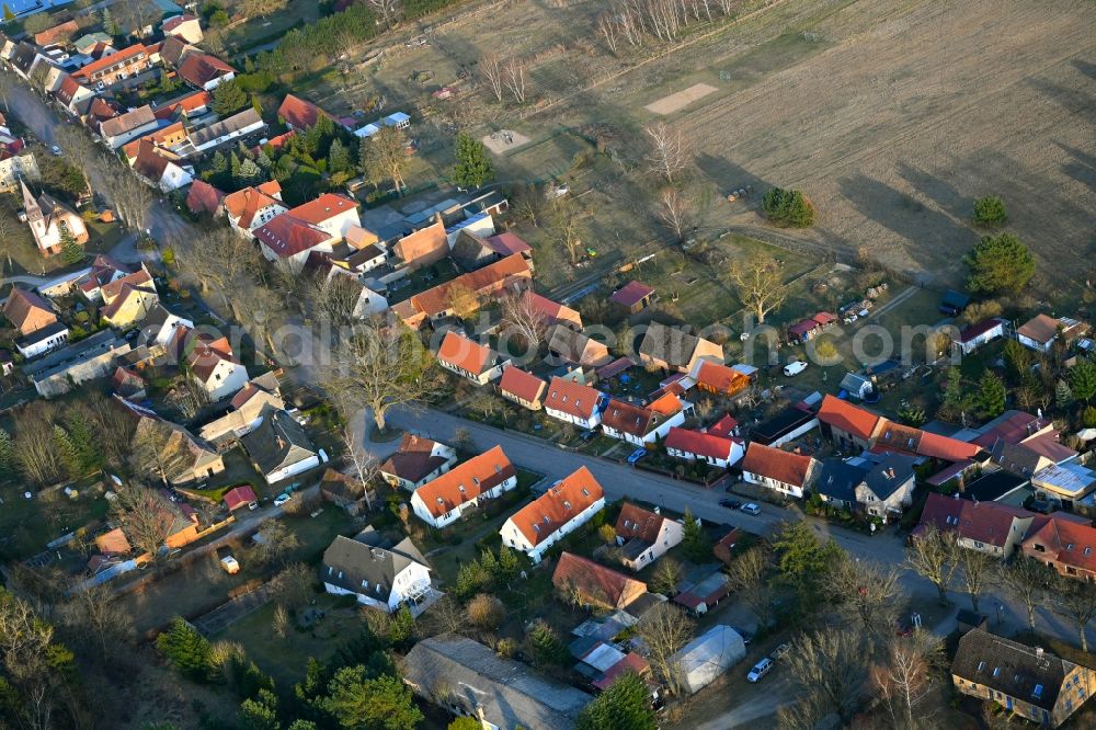 Kleinzerlang from above - Agricultural land and field boundaries surround the settlement area of the village in Kleinzerlang in the state Brandenburg, Germany