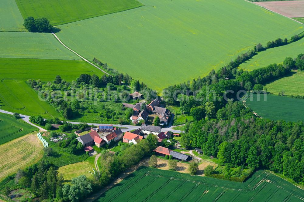 Külsheim from above - Agricultural land and field boundaries surround the settlement area of the village in Külsheim in the state Baden-Wuerttemberg, Germany