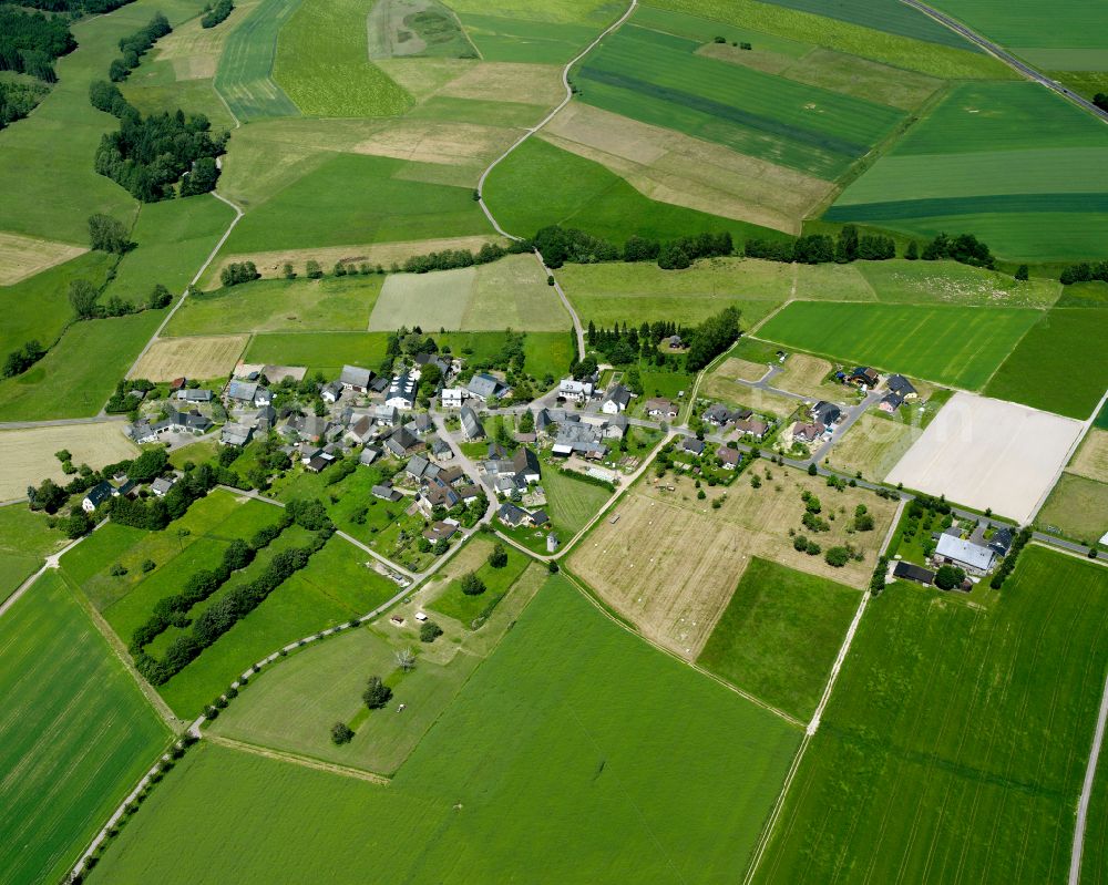 Aerial photograph Kludenbach - Agricultural land and field boundaries surround the settlement area of the village in Kludenbach in the state Rhineland-Palatinate, Germany