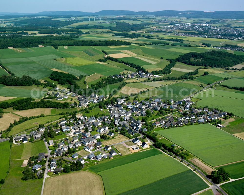 Aerial image Külz (Hunsrück) - Agricultural land and field boundaries surround the settlement area of the village in Külz (Hunsrück) in the state Rhineland-Palatinate, Germany