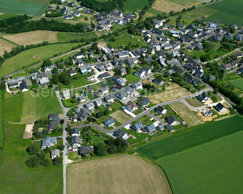 Külz (Hunsrück) from the bird's eye view: Agricultural land and field boundaries surround the settlement area of the village in Külz (Hunsrück) in the state Rhineland-Palatinate, Germany