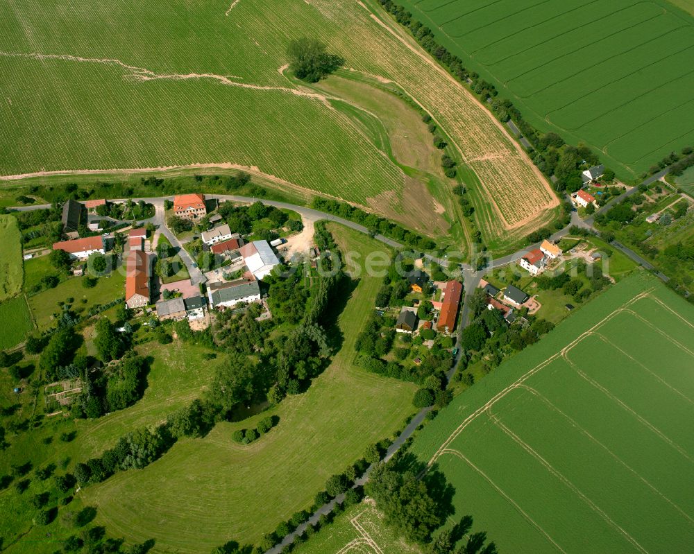 Kmehlen from above - Agricultural land and field boundaries surround the settlement area of the village in Kmehlen in the state Saxony, Germany