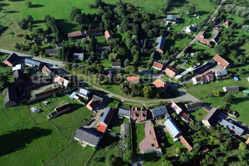 Kümmernitztal from above - Agricultural land and field boundaries surround the settlement area of the village on street Ringstrasse in Kuemmernitztal in the state Brandenburg, Germany