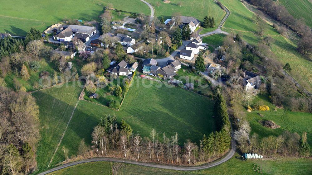 Aerial image Knippgierscheid - Agricultural land and field boundaries surround the settlement area of the village in Knippgierscheid in the state North Rhine-Westphalia, Germany