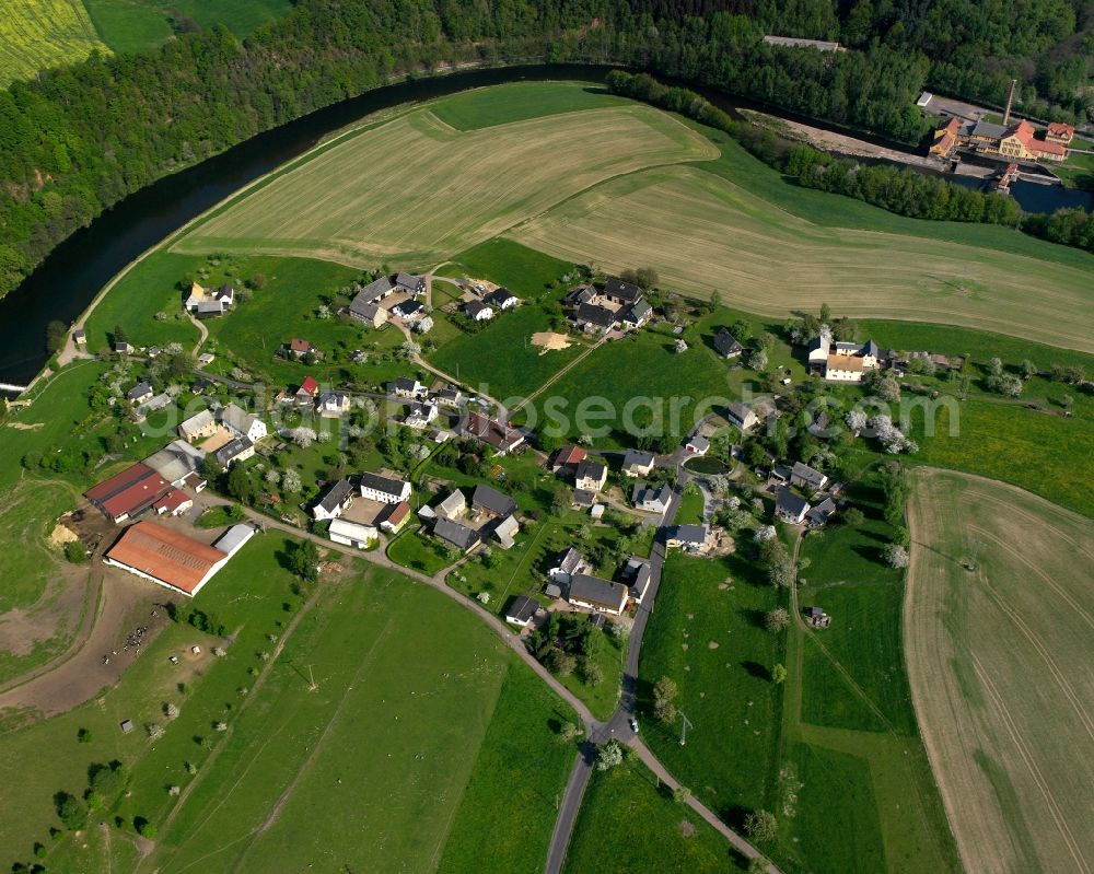 Kockisch from above - Agricultural land and field boundaries surround the settlement area of the village in Kockisch in the state Saxony, Germany