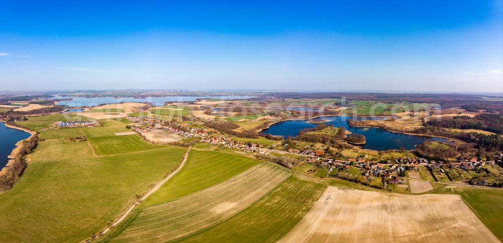 Aerial photograph Chorin - Agricultural land and field boundaries surround the settlement area of the village vom Oekodorf Brodowin in Chorin in the state Brandenburg, Germany