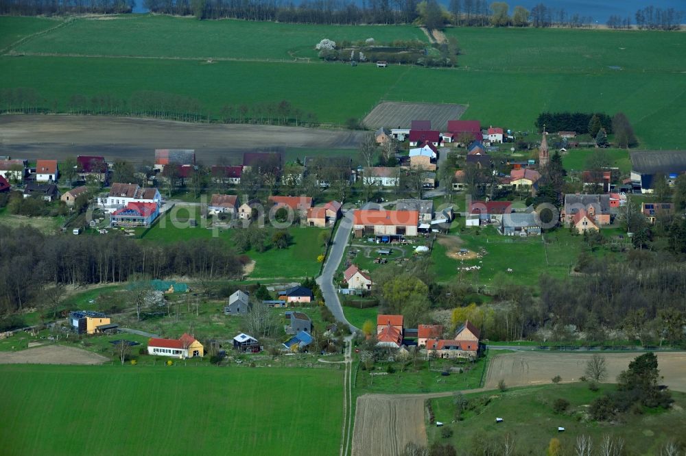 Aerial image Brodowin - Agricultural land and field boundaries surround the settlement area of the village vom Oekodorf Brodowin in the state Brandenburg, Germany