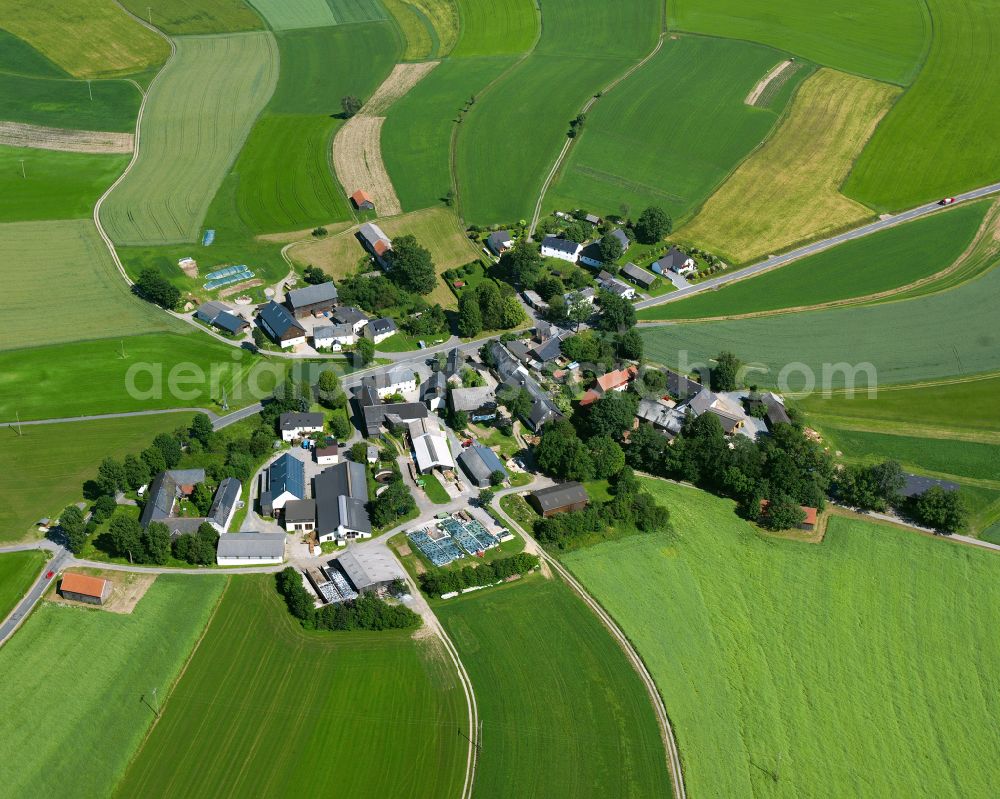 Konradsreuth from above - Agricultural land and field boundaries surround the settlement area of the village in the district Silberbach in Konradsreuth in the state Bavaria, Germany