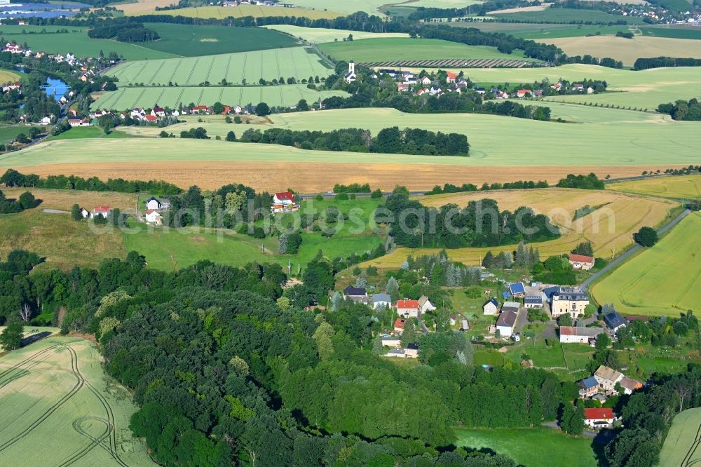 Korpitzsch from the bird's eye view: Agricultural land and field boundaries surround the settlement area of the village in Korpitzsch in the state Saxony, Germany