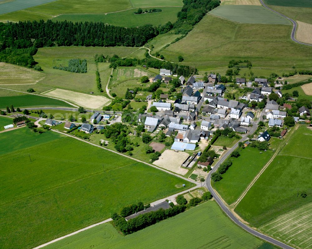 Korweiler from above - Agricultural land and field boundaries surround the settlement area of the village in Korweiler in the state Rhineland-Palatinate, Germany