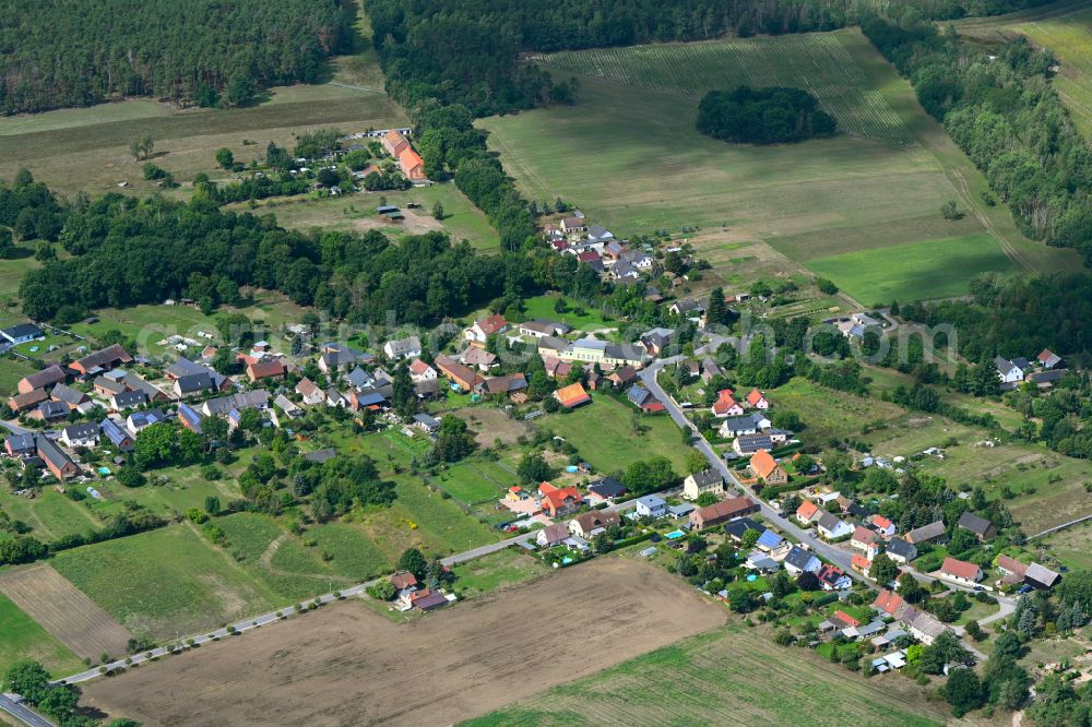 Koßwig from above - Agricultural land and field boundaries surround the settlement area of the village on street Kosswiger Dorfstrasse in Kosswig in the state Brandenburg, Germany