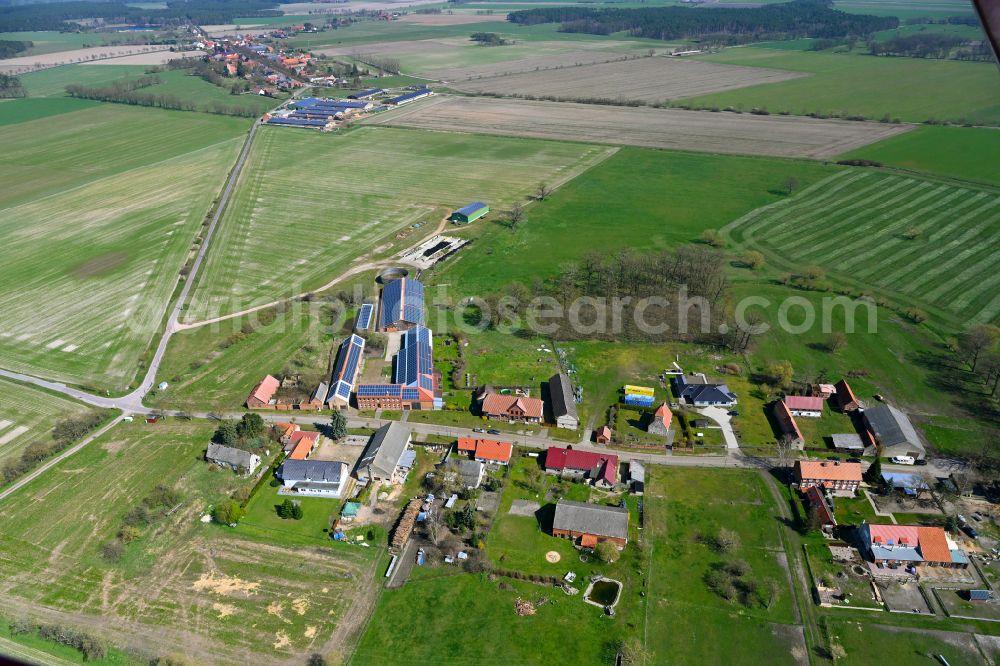 Kraatz from the bird's eye view: Agricultural land and field boundaries surround the settlement area of the village in Kraatz in the state Saxony-Anhalt, Germany